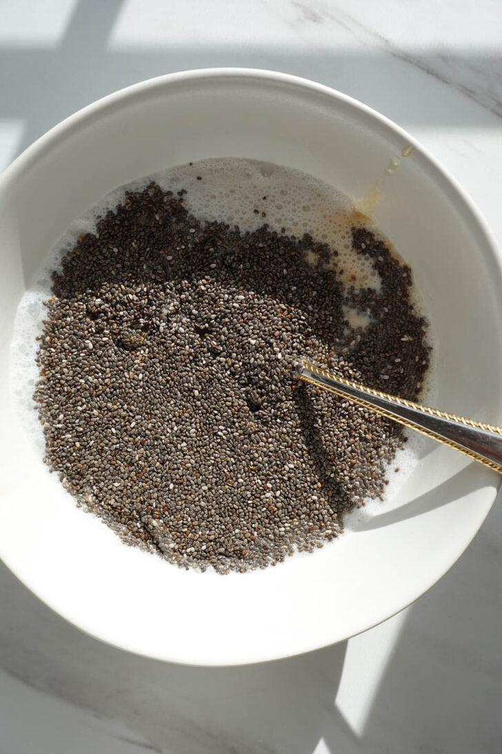 mixing chia seeds with non-dairy milk for chia pudding