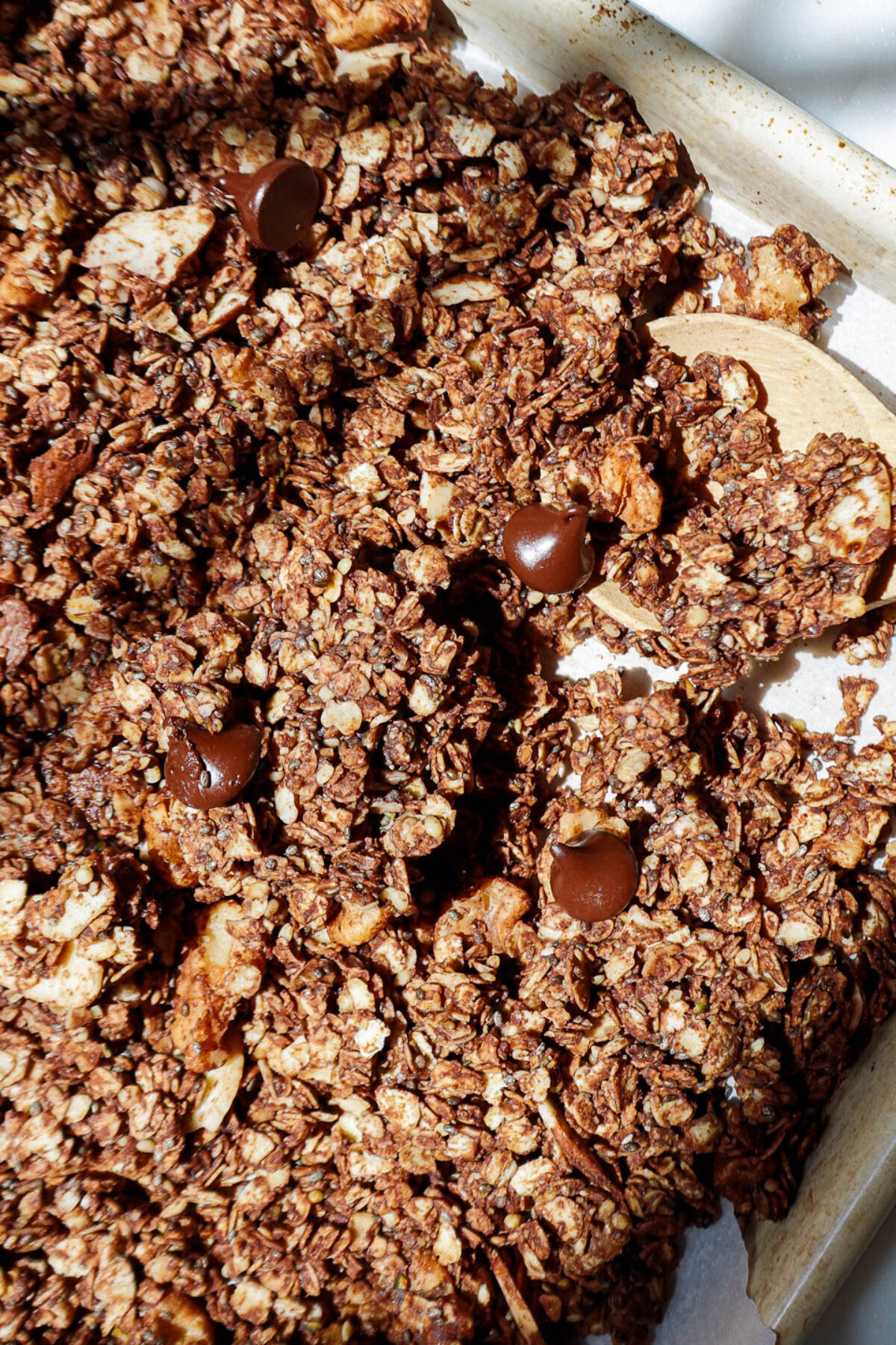 Overhead shot of chocolate granola with dark chocolate chips and nuts
