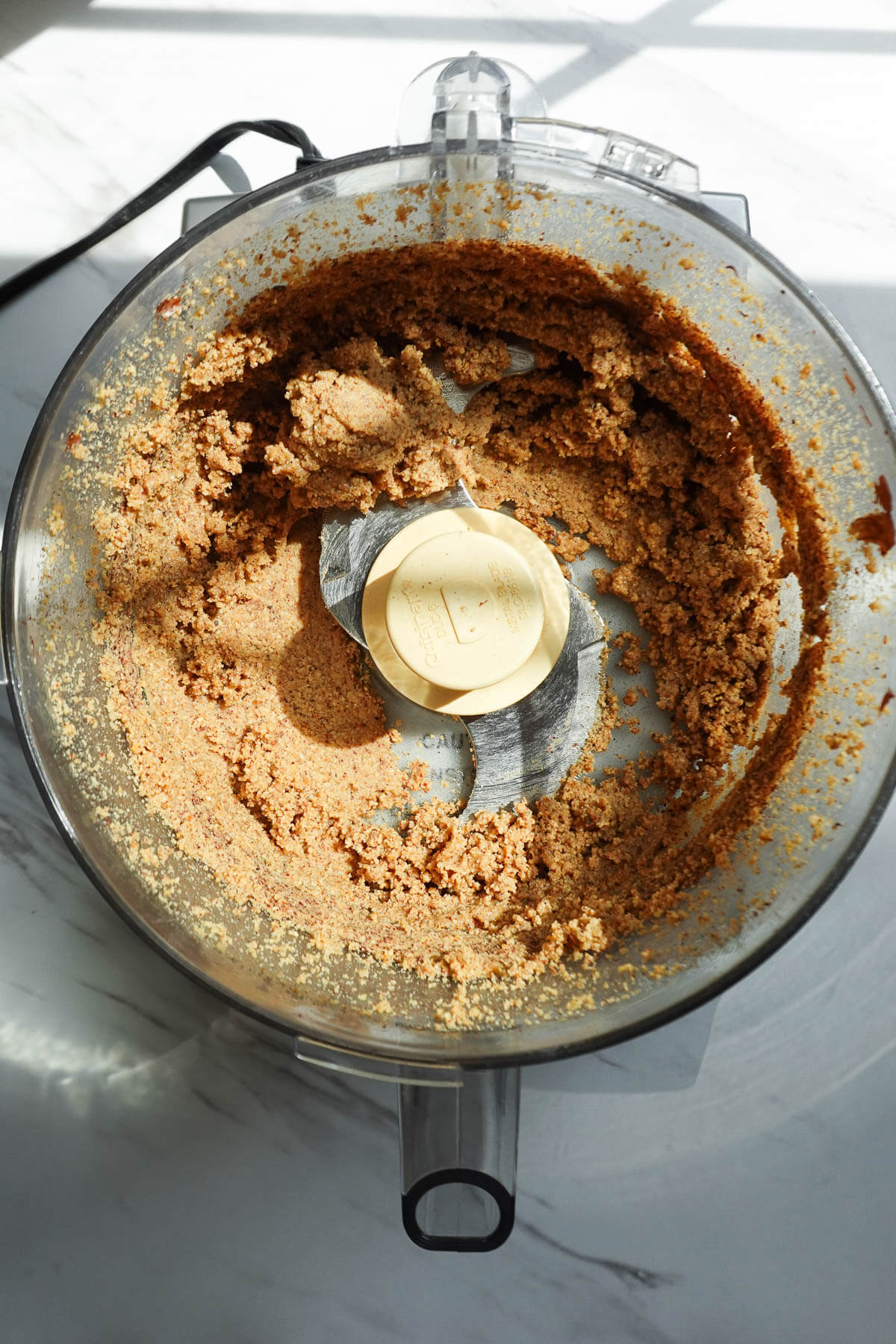 Hazelnuts in the crumbly stage while blending.