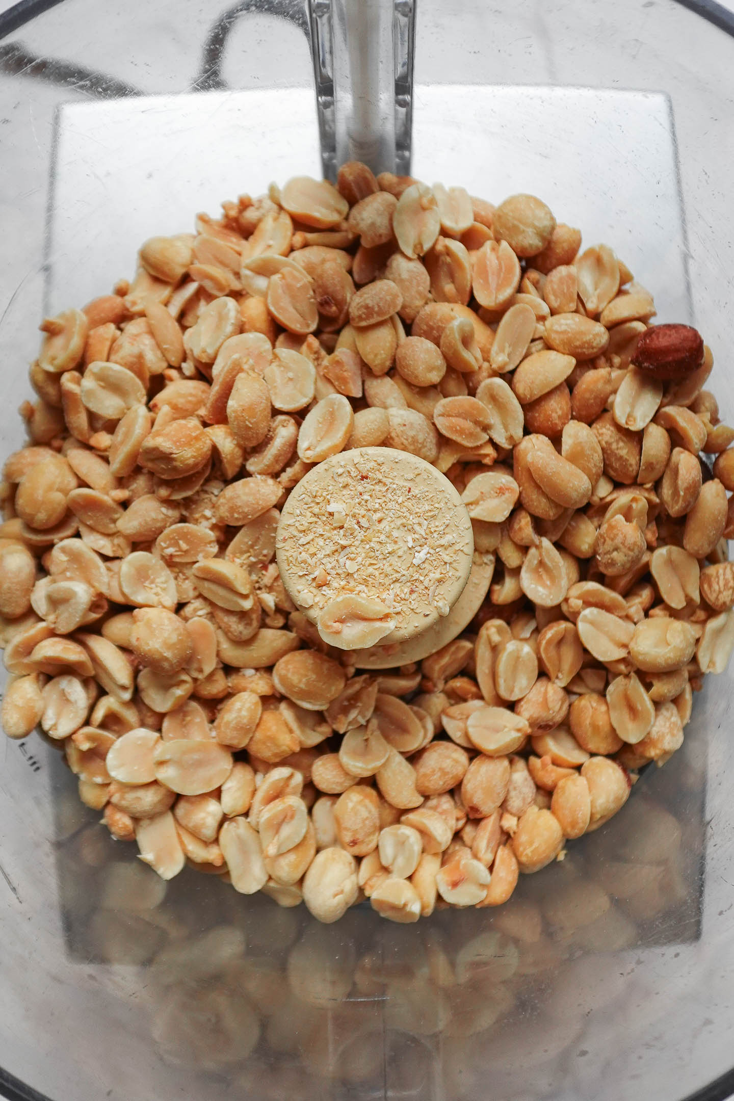 Peanuts in a food processor before blending into peanut butter