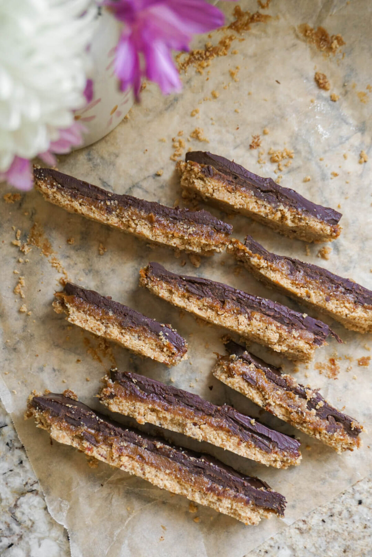 These Vegan Twix Bars are no bake, gluten free, refined sugar free & taste like the real thing – without all the sugar!