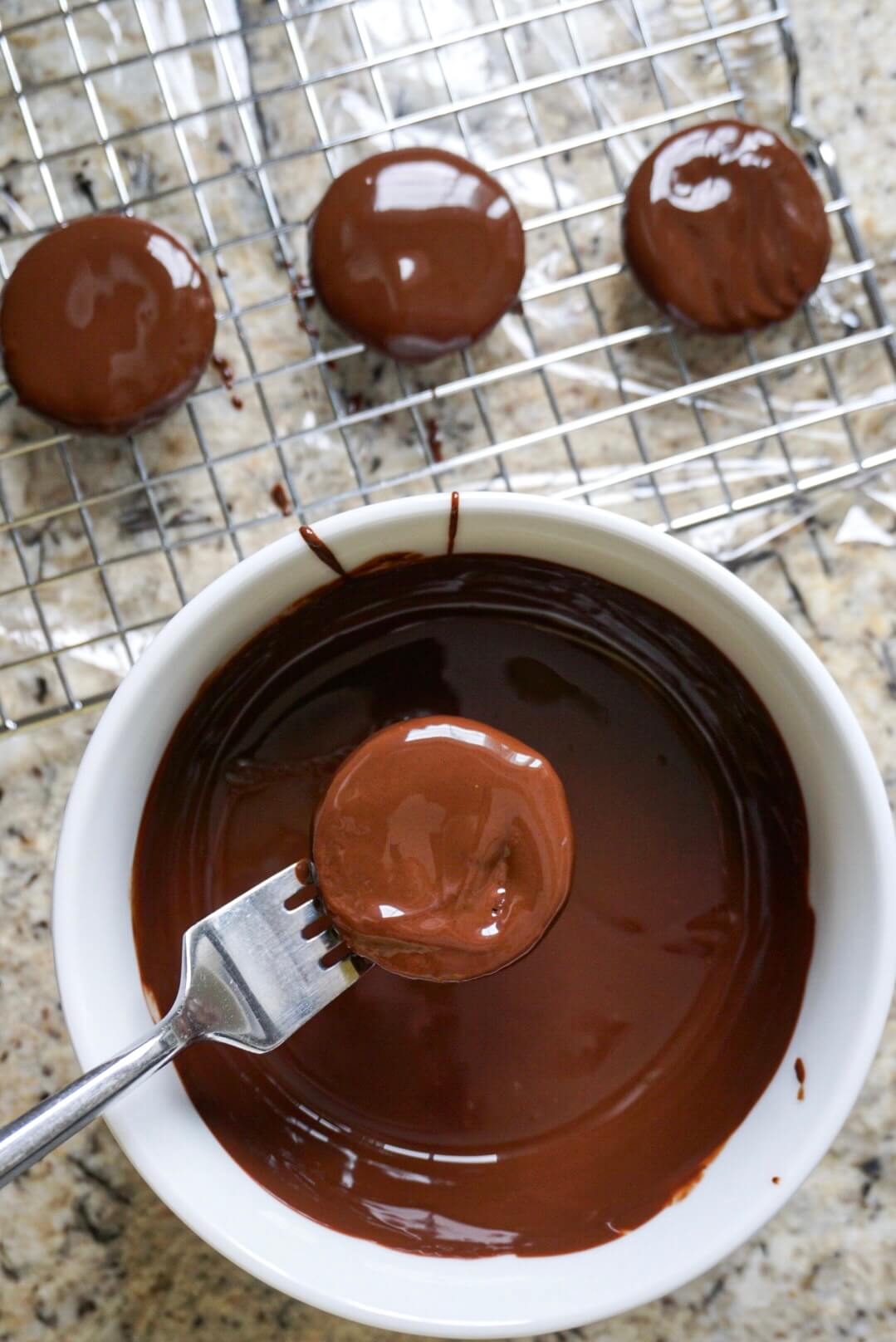 Dipping Homemade Thin Mints in chocolate