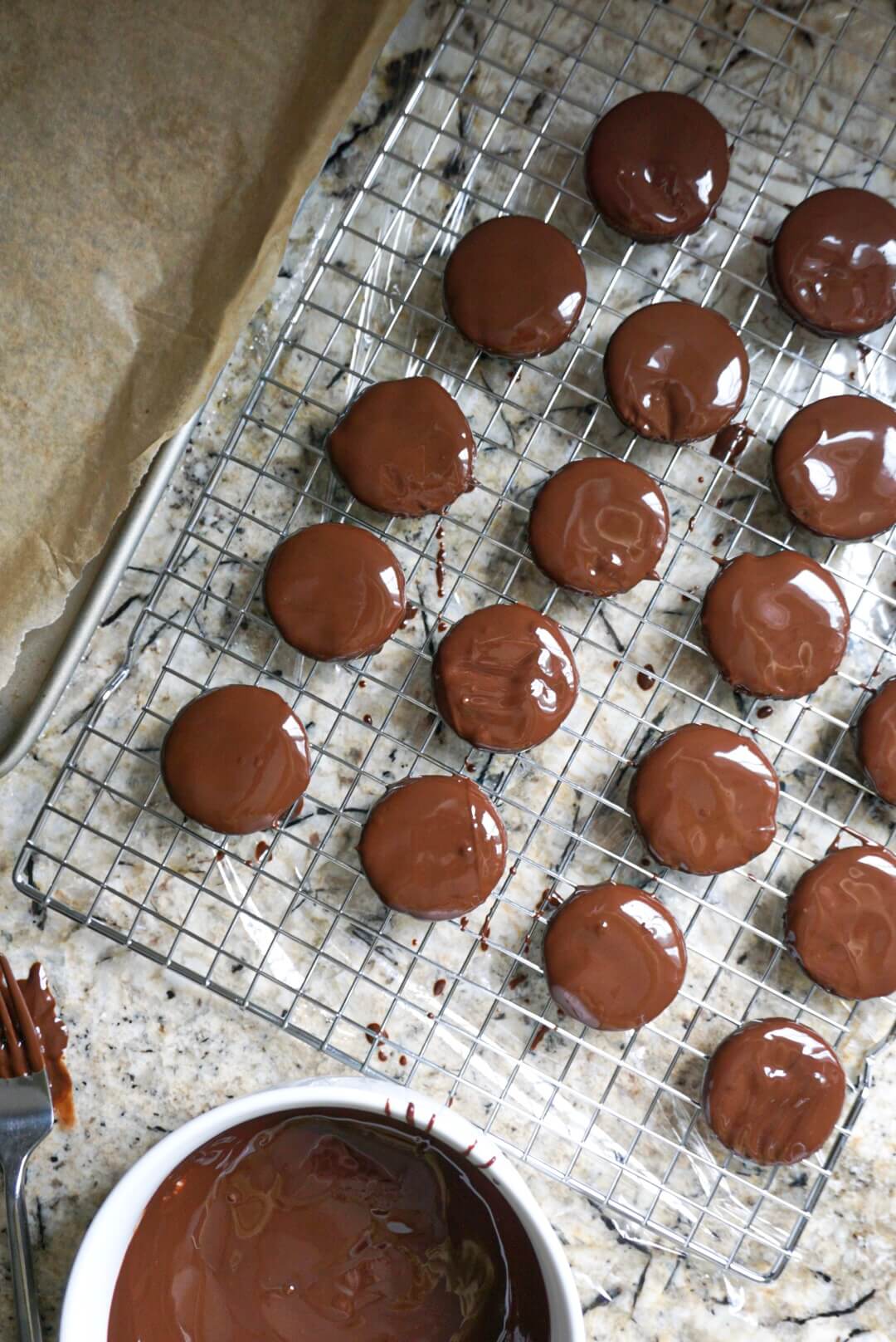 Homemade Thin Mints coated in chocolate waiting to set