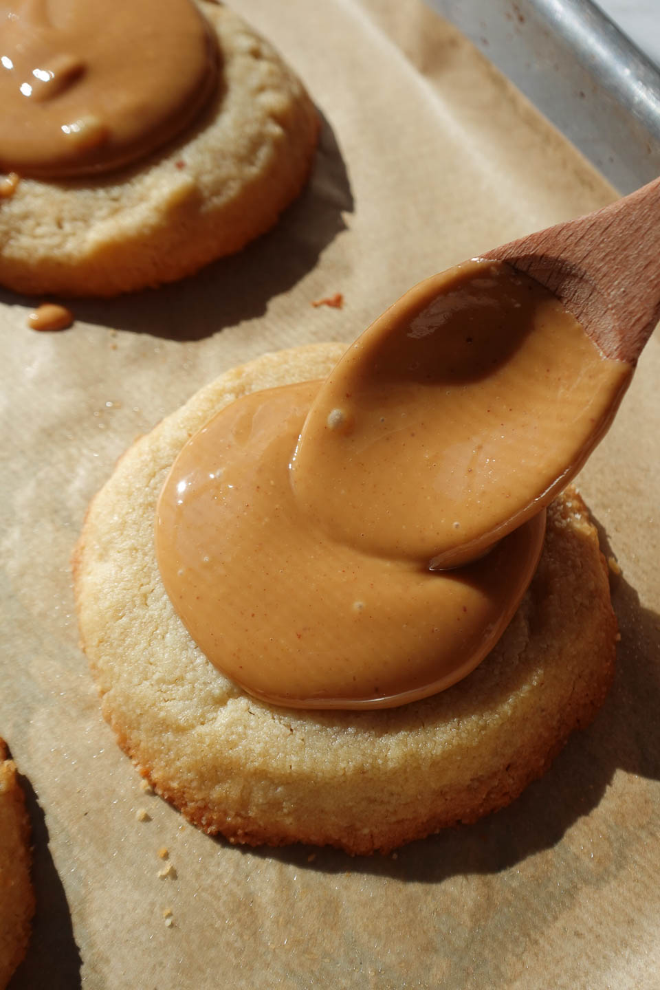adding peanut butter to Tagalong cookie center
