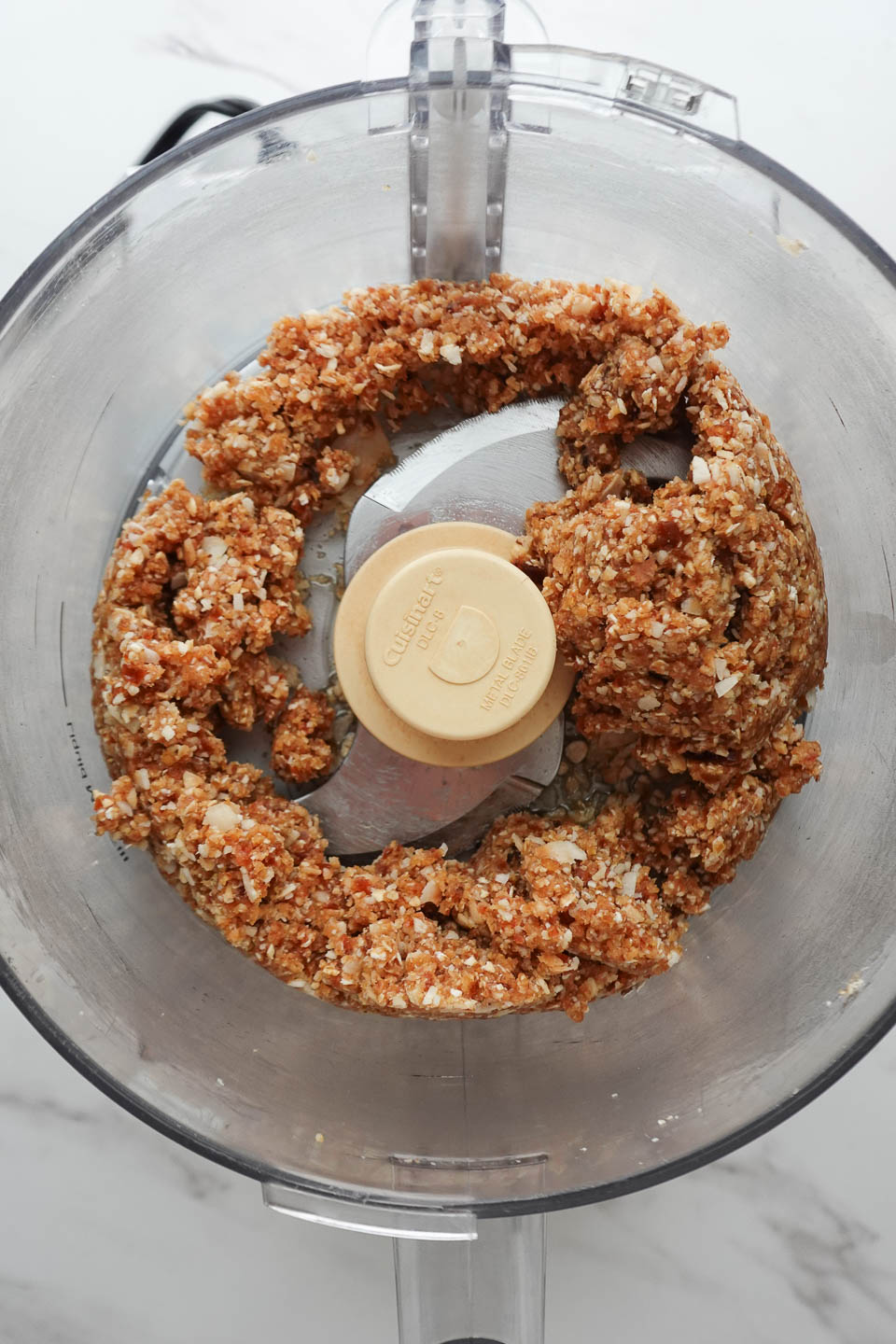 mixing ingredients in a food processor for samoas cookies