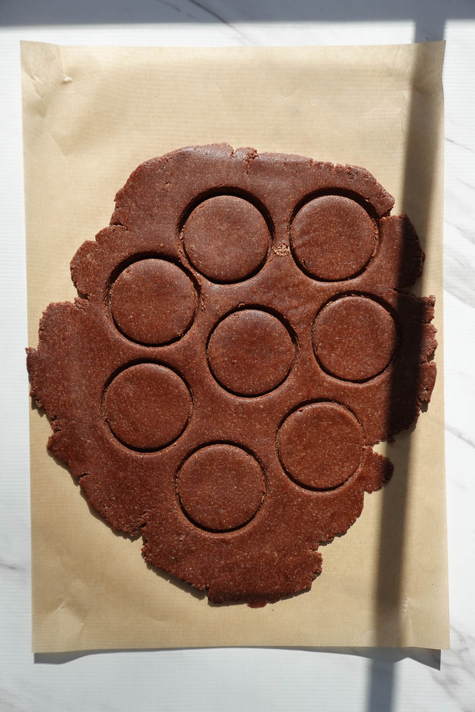 cutting chocolate mint cookies before baking