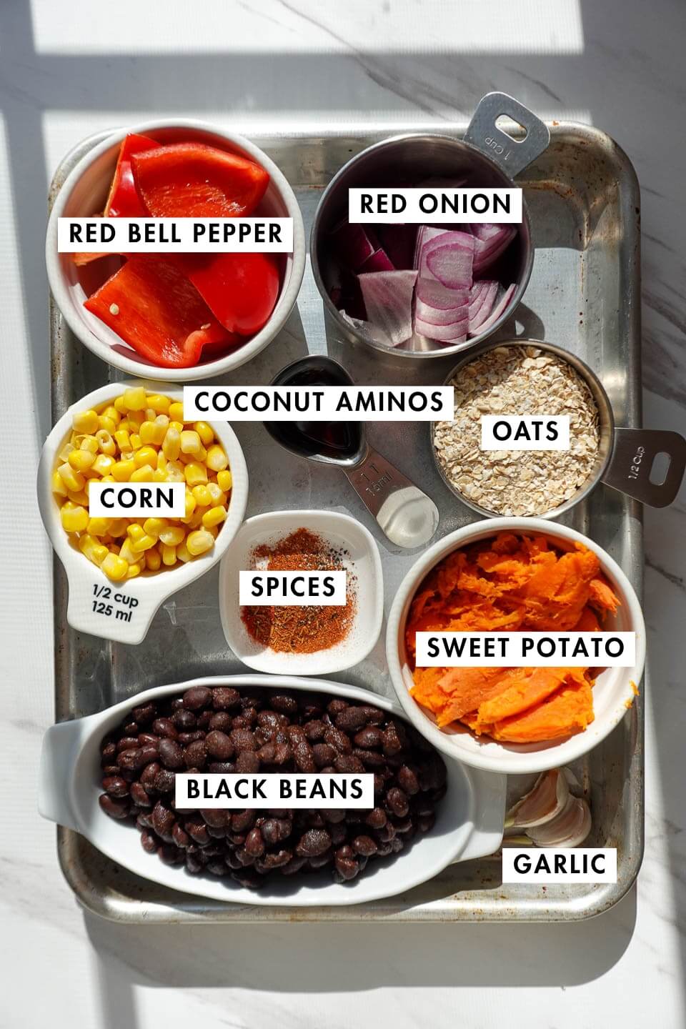 Ingredients for black bean sweet potato veggie burgers on a countertop