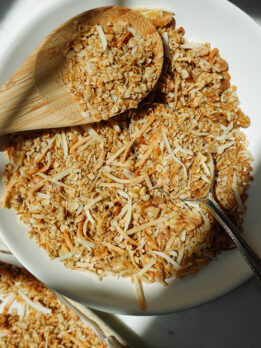 healthy homemade granola in a bowl with a wooden spoon, only 5 ingredients