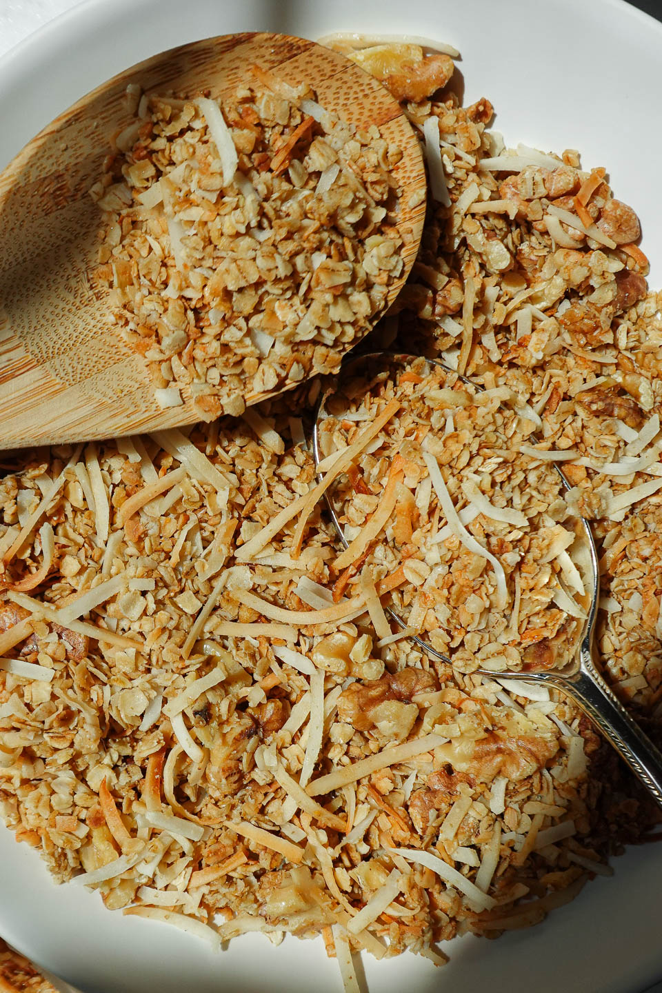 close up of 5 ingredient granola in a bowl with a spoon