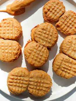homemade nutter butter cookies with peanut butter filling on a plate