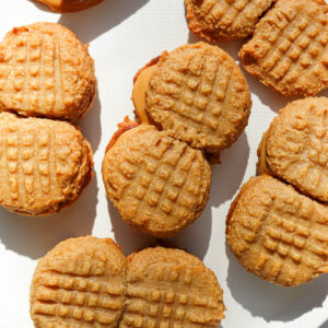 homemade nutter butter cookies with peanut butter filling on a plate