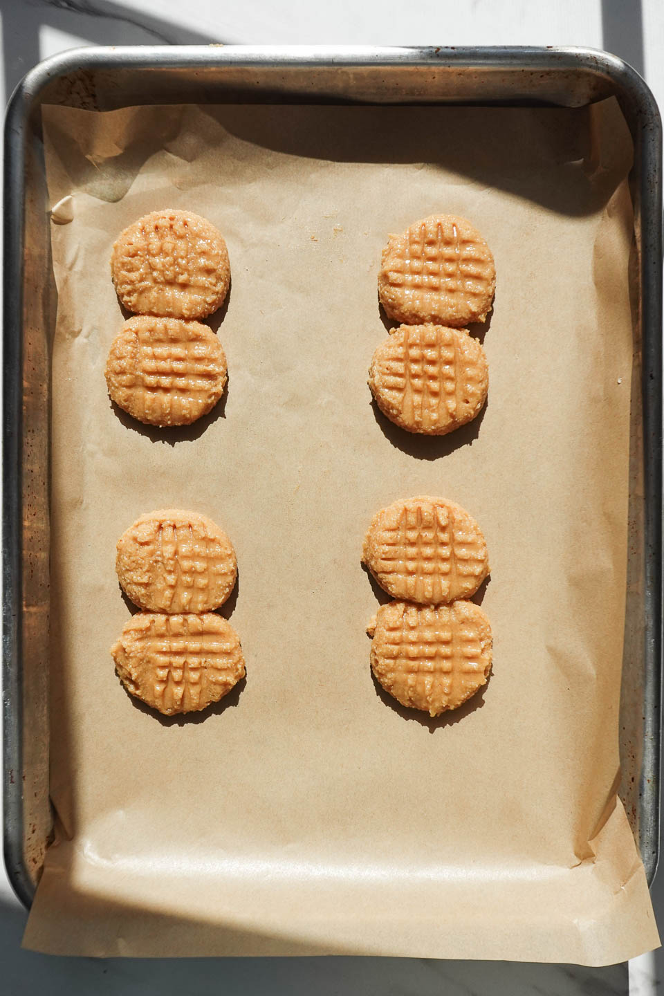 homemade nutter butter cookies on baking sheet