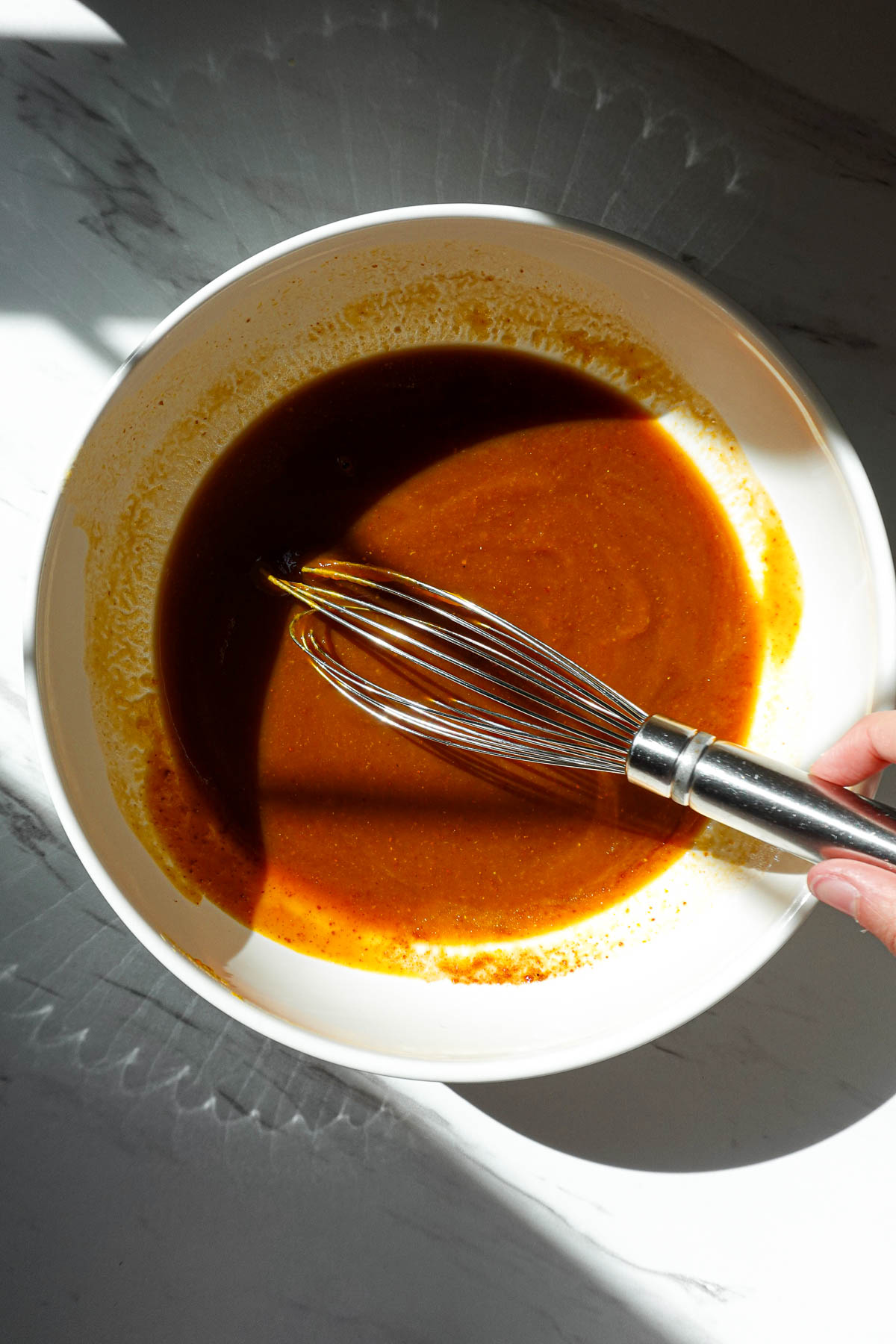 Whisking the pumpkin puree and other wet ingredients.