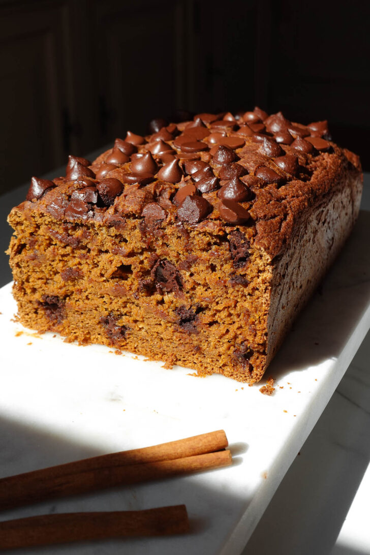 Sliced vegan and gluten-free pumpkin bread showing it's soft, moist, and fluffy texture.