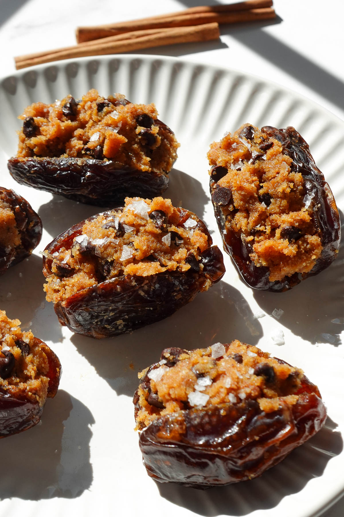 Pumpkin cookie dough stuffed dates topped with mini chocolate chips and flaky sea salt.