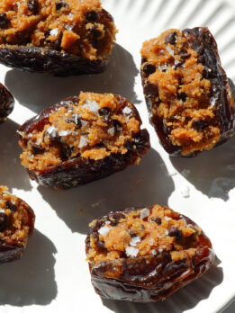 Pumpkin stuffed dates filled with pumpkin cookie dough and topped with chocolate chips.