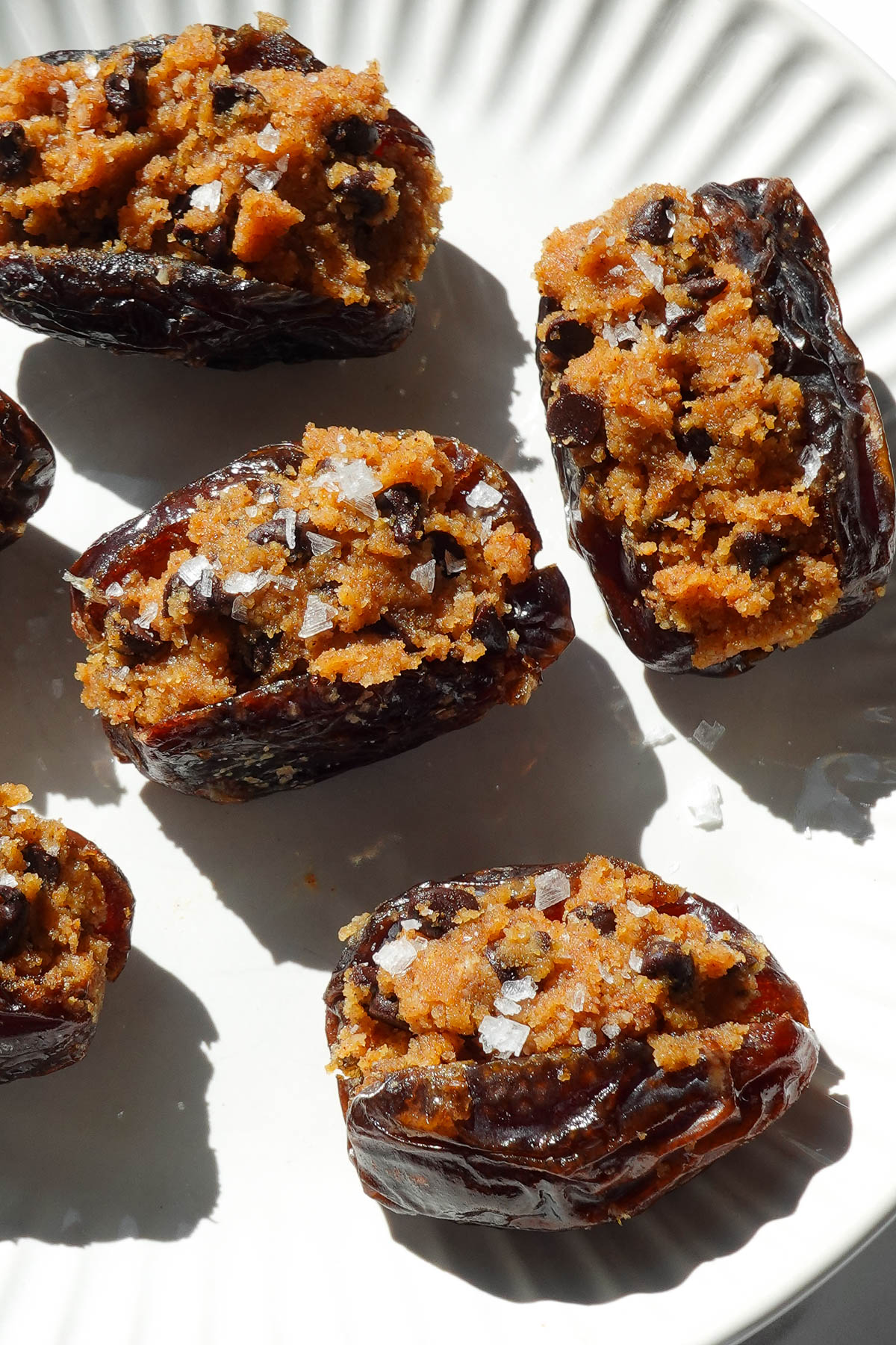 Pumpkin stuffed dates filled with pumpkin cookie dough and topped with chocolate chips.