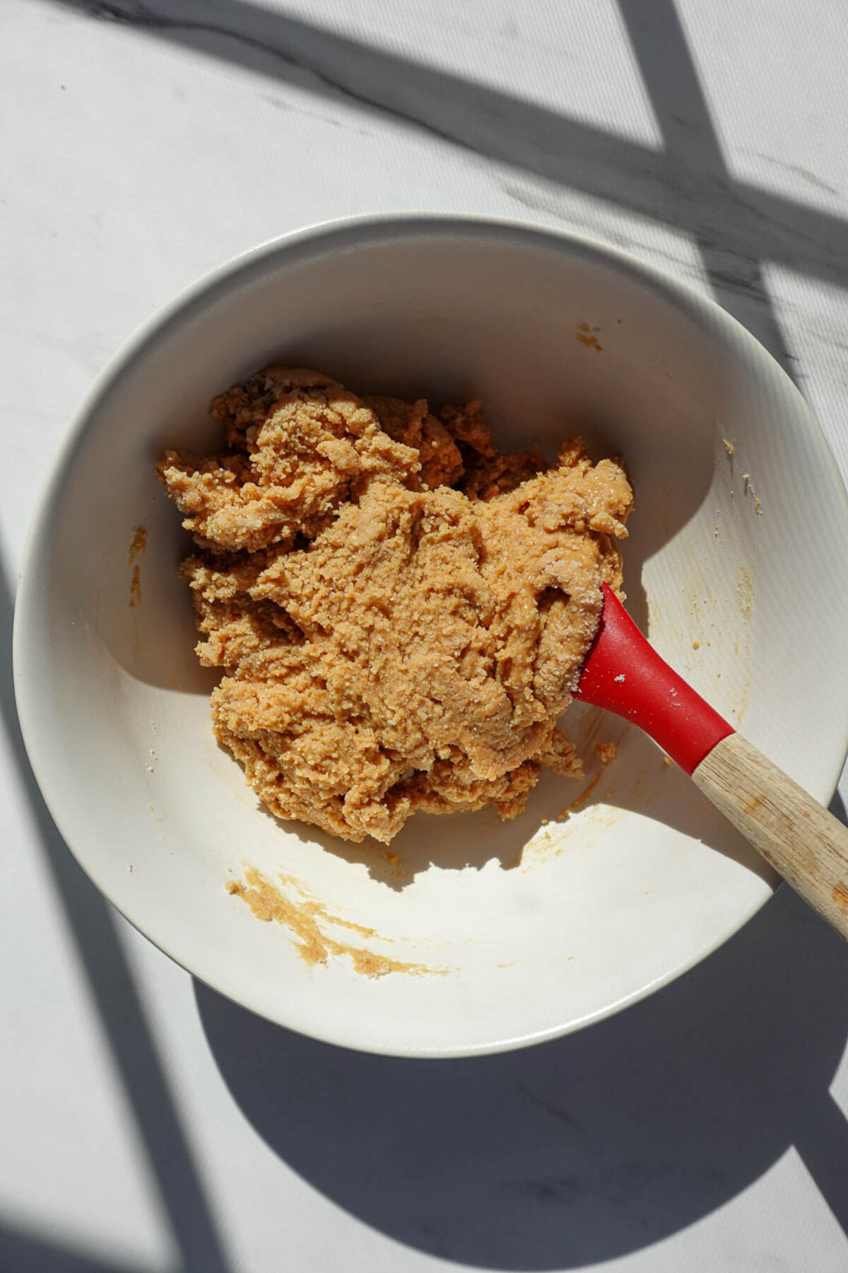 Peanut butter, almond flour, and maple syrup mixed together to form peanut butter egg filling