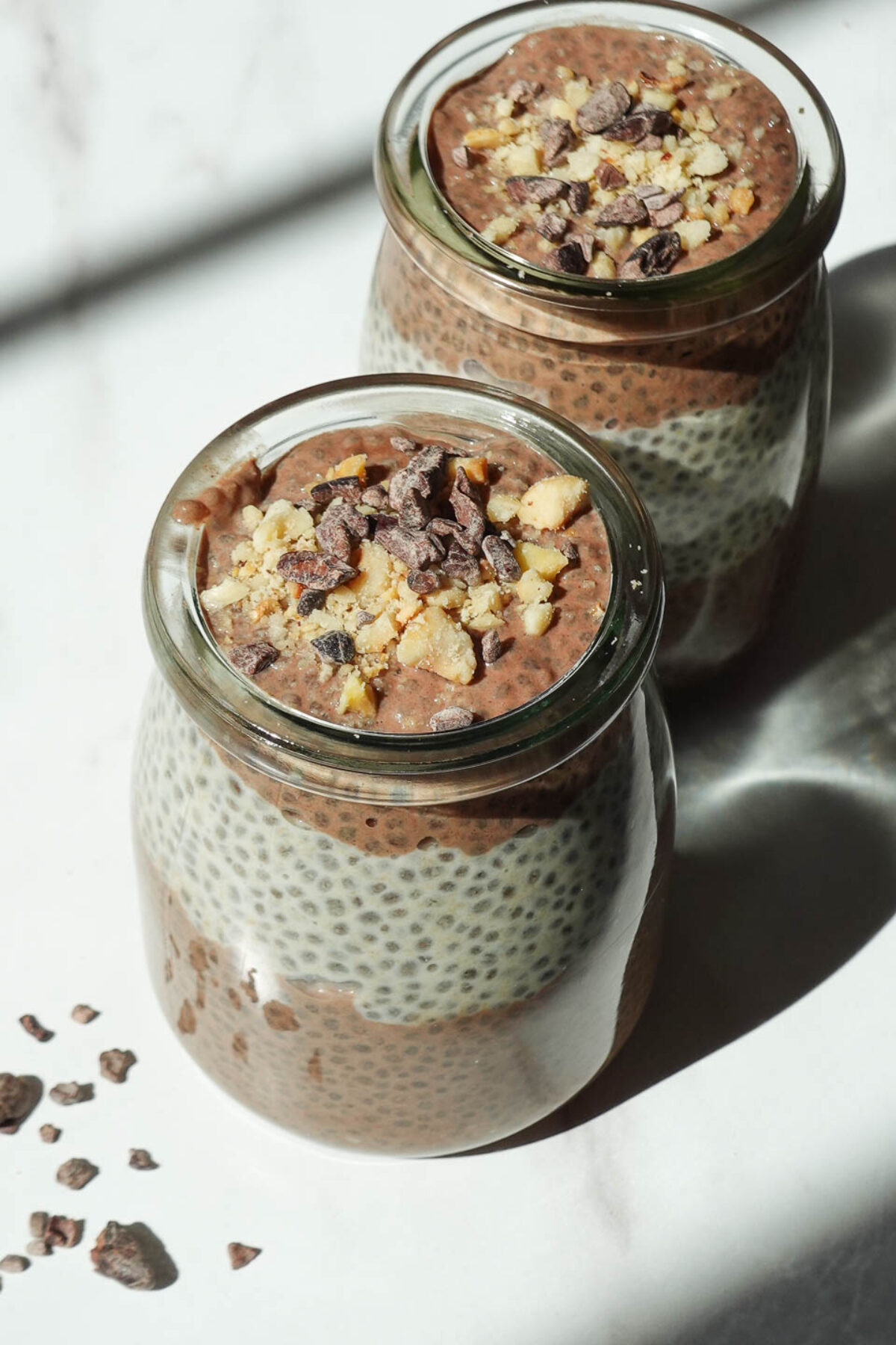 Chocolate peanut butter chia pudding in jars for a meal prep breakfast or healthy snack