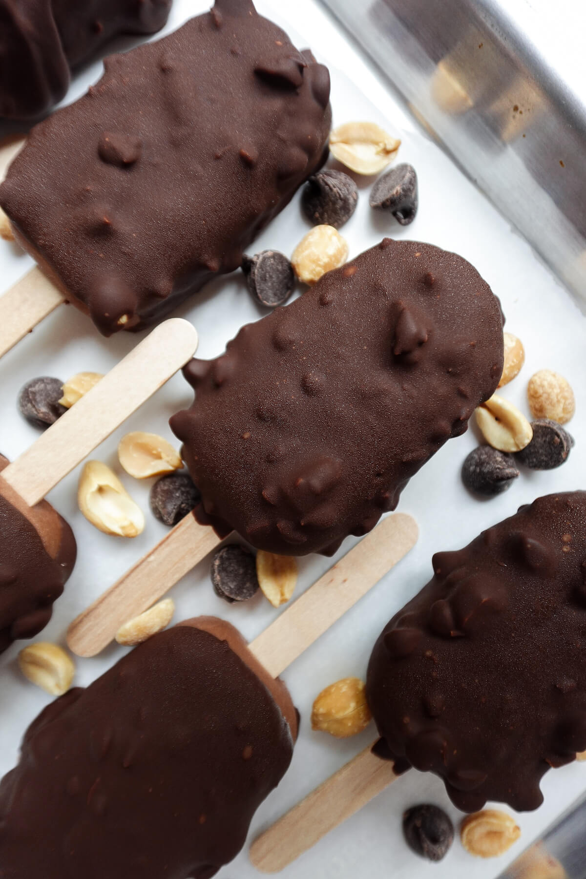 Vegan Chocolate Crunch Ice Cream Bars are made with just 7 simple ingredients featuring a creamy chocolate 'ice cream' encased in a crunchy peanut & chocolate shell.