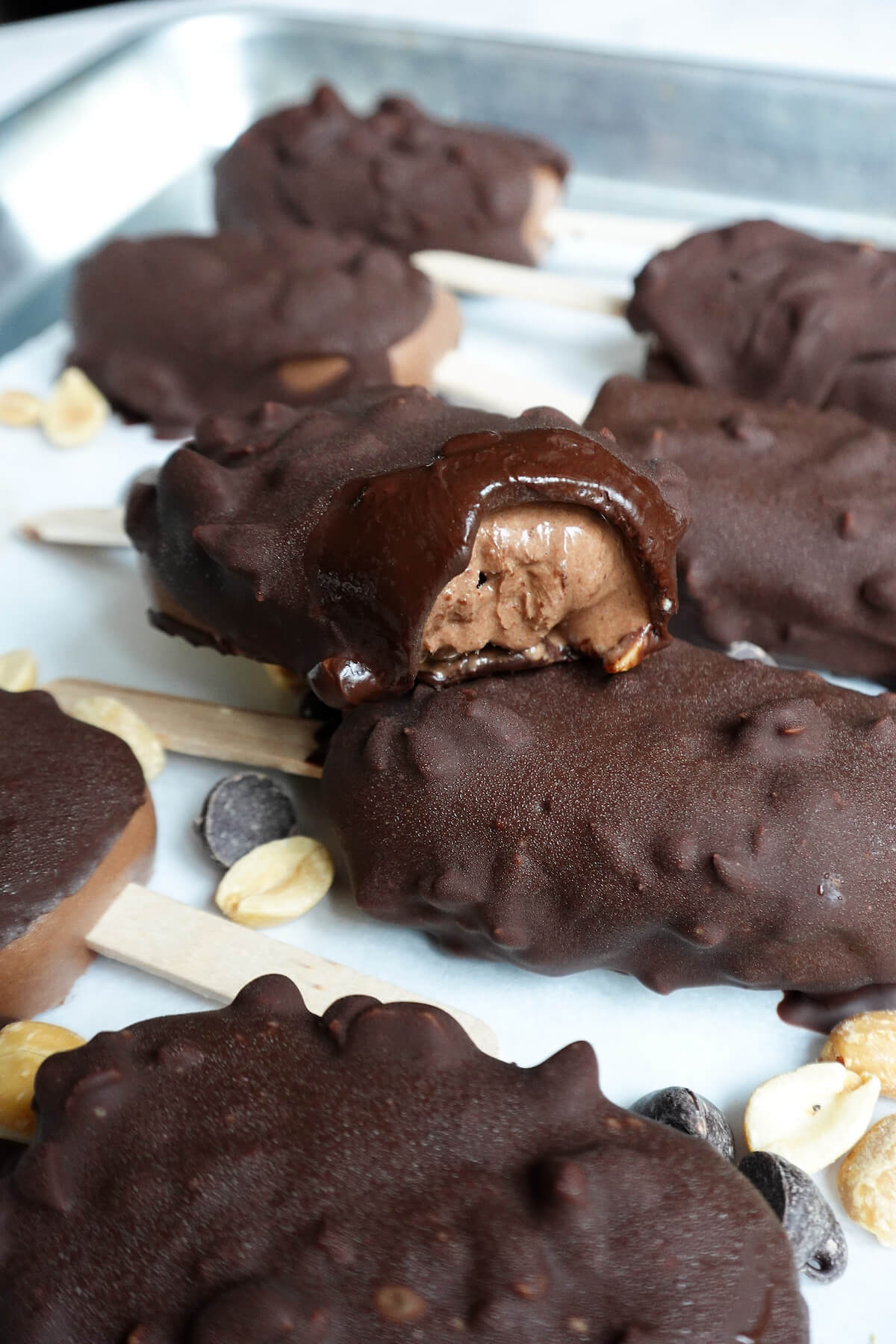 Vegan Chocolate Crunch Ice Cream Bars are made with just 7 simple ingredients featuring a creamy chocolate 'ice cream' encased in a crunchy peanut & chocolate shell.