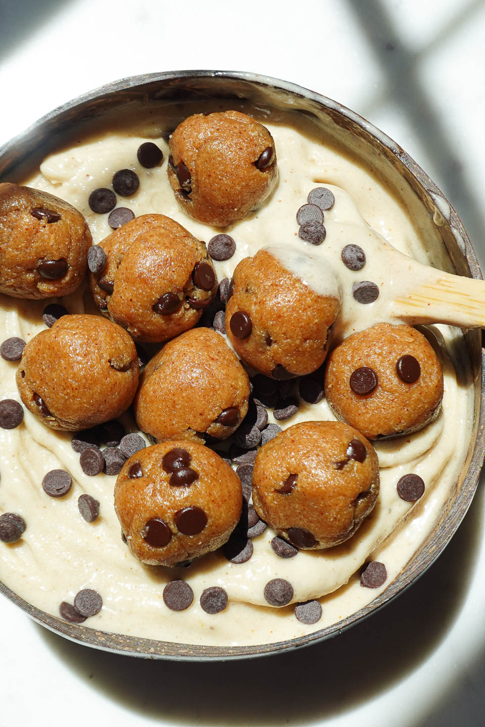 Creamy texture of banana nice cream with chunks of edible cookie dough throughout