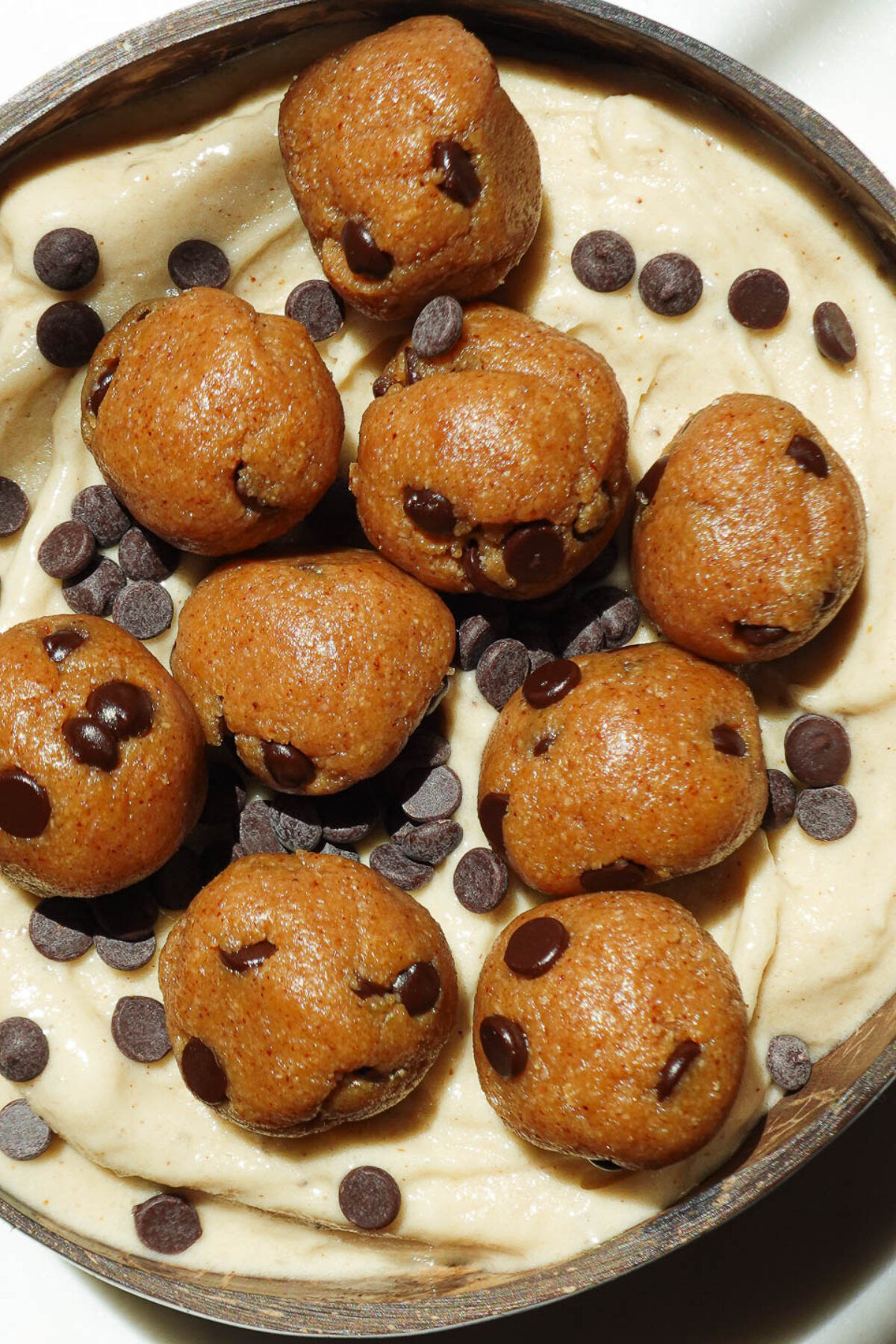 Creamy texture of banana nice cream with chunks of edible cookie dough throughout.