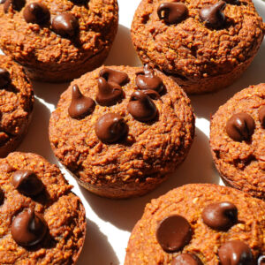 freshly baked batch of vegan and gluten-free pumpkin muffins