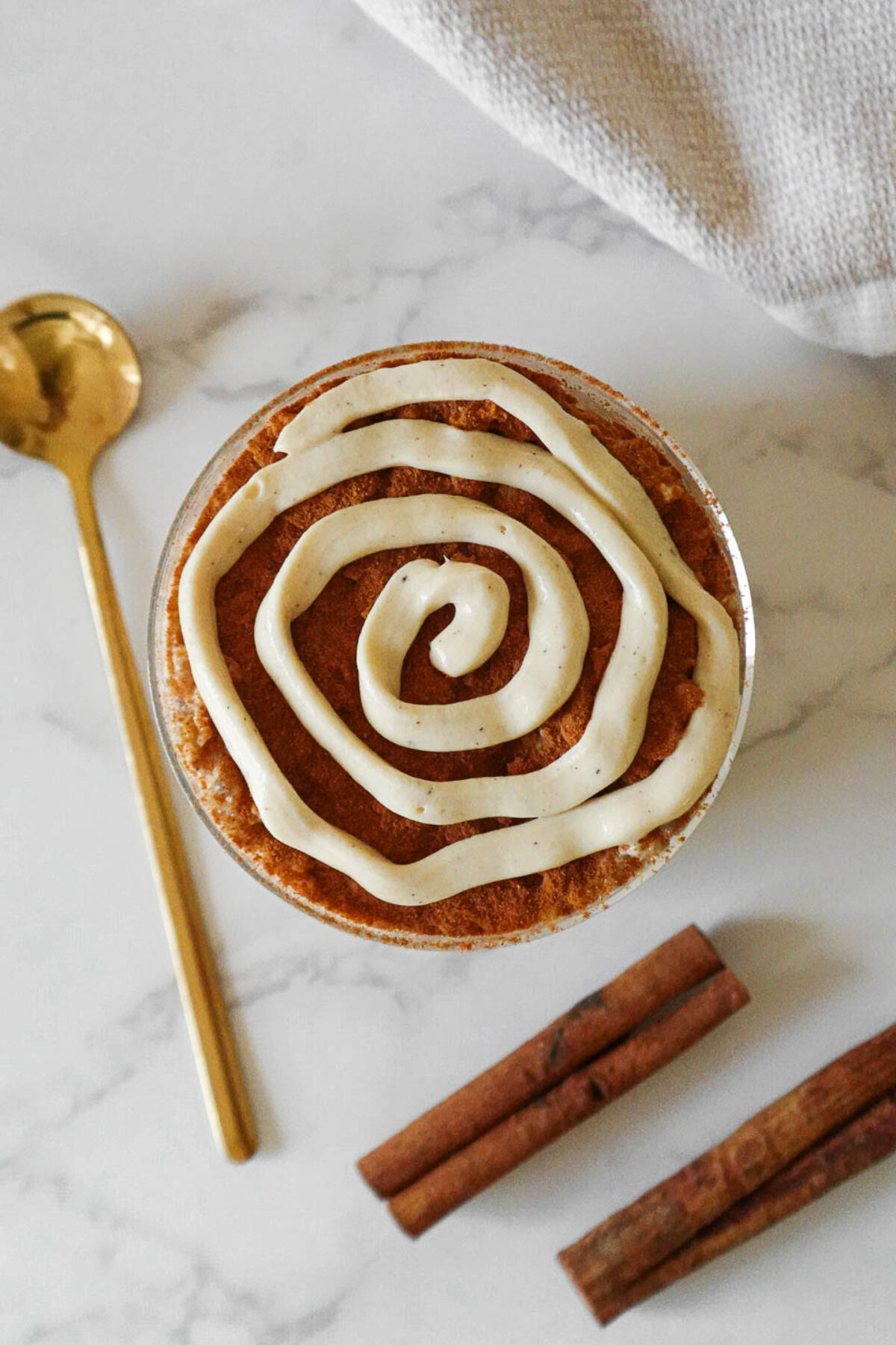 Healthy Cinnamon Roll Overnight Oats with a yogurt swirl.