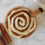 Easy Cinnamon Roll Overnight Oats with a yogurt swirl and a cinnamon stick