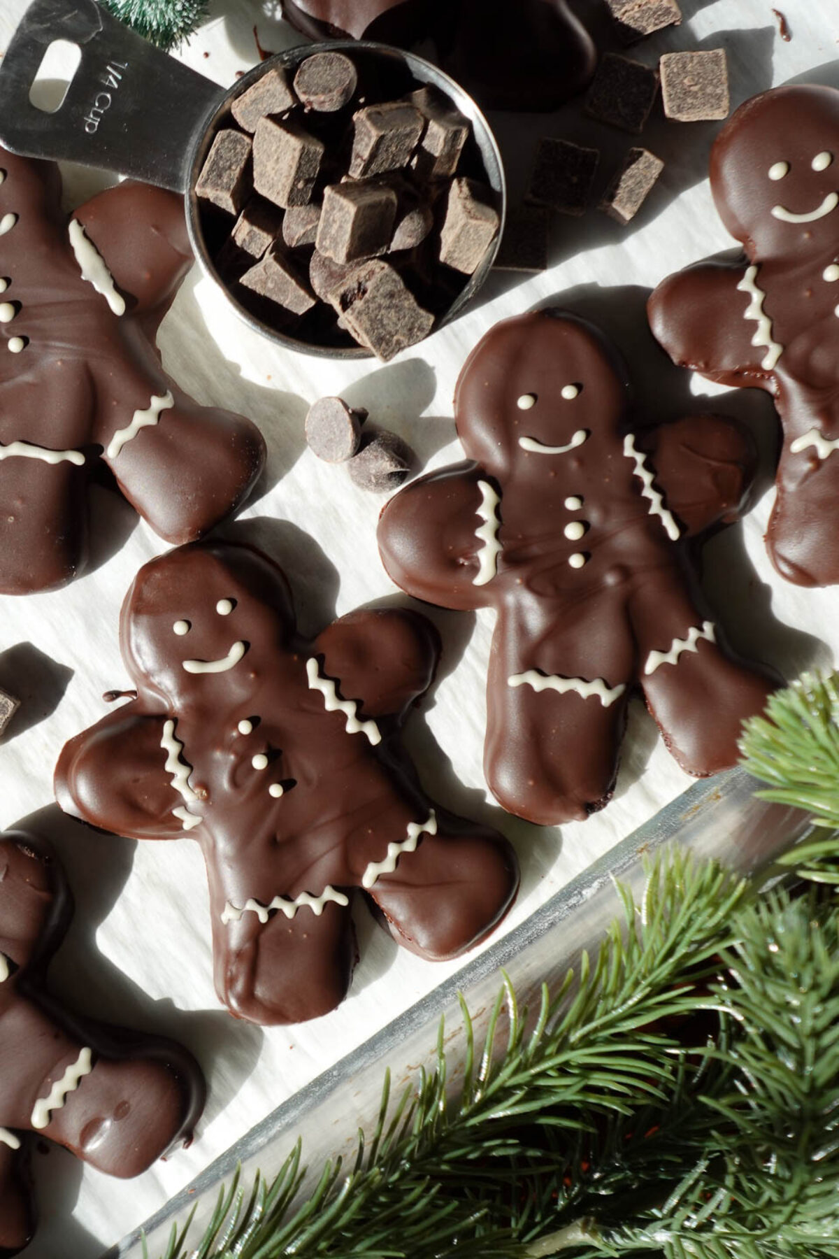 Gluten-free vegan chocolate peppermint gingerbread cookies decorated with white chocolate details
