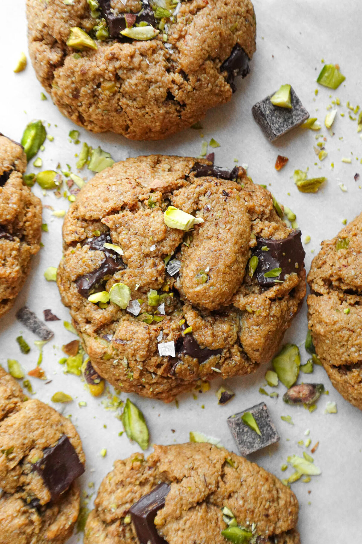 Close-up of soft, chewy pistachio chocolate chip cookies made with oat flour