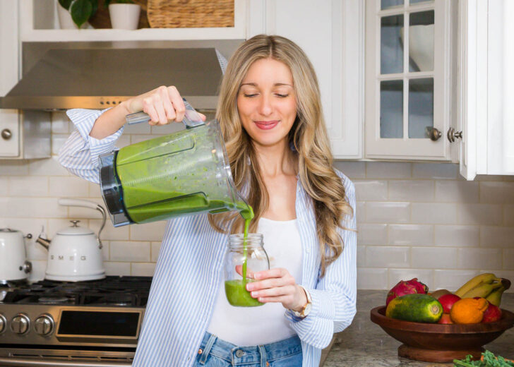megan pouring a green smoothie from the blender