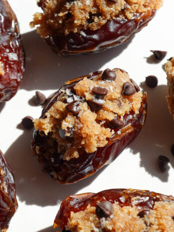 Vegan cookie dough stuffed dates filled with almond flour cookie dough and mini chocolate chips.