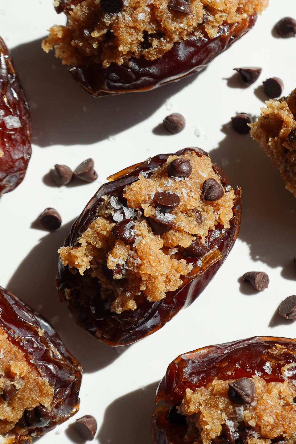 No-bake, gluten-free cookie dough stuffed dates with a drizzle of melted chocolate.