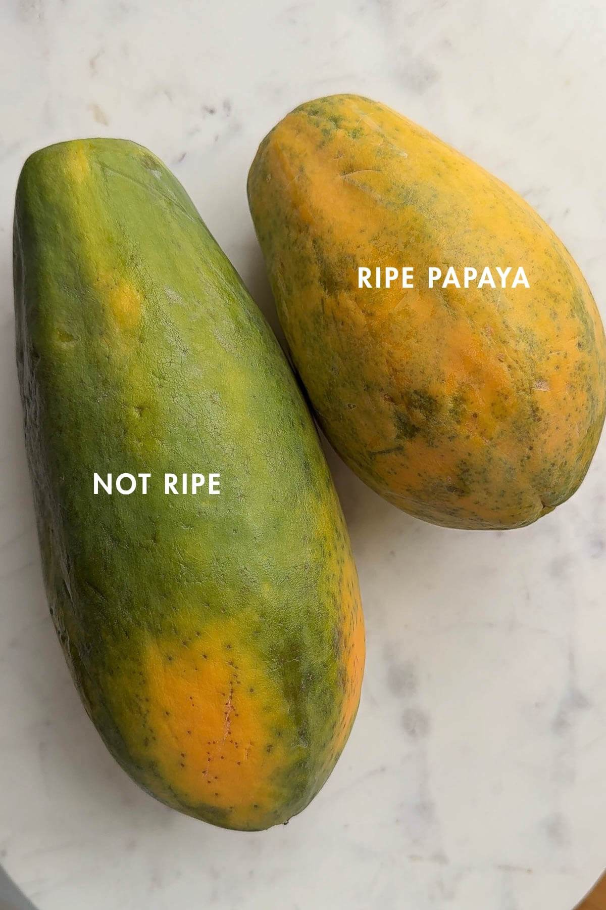Showing a ripe versus not ripe papaya side by side