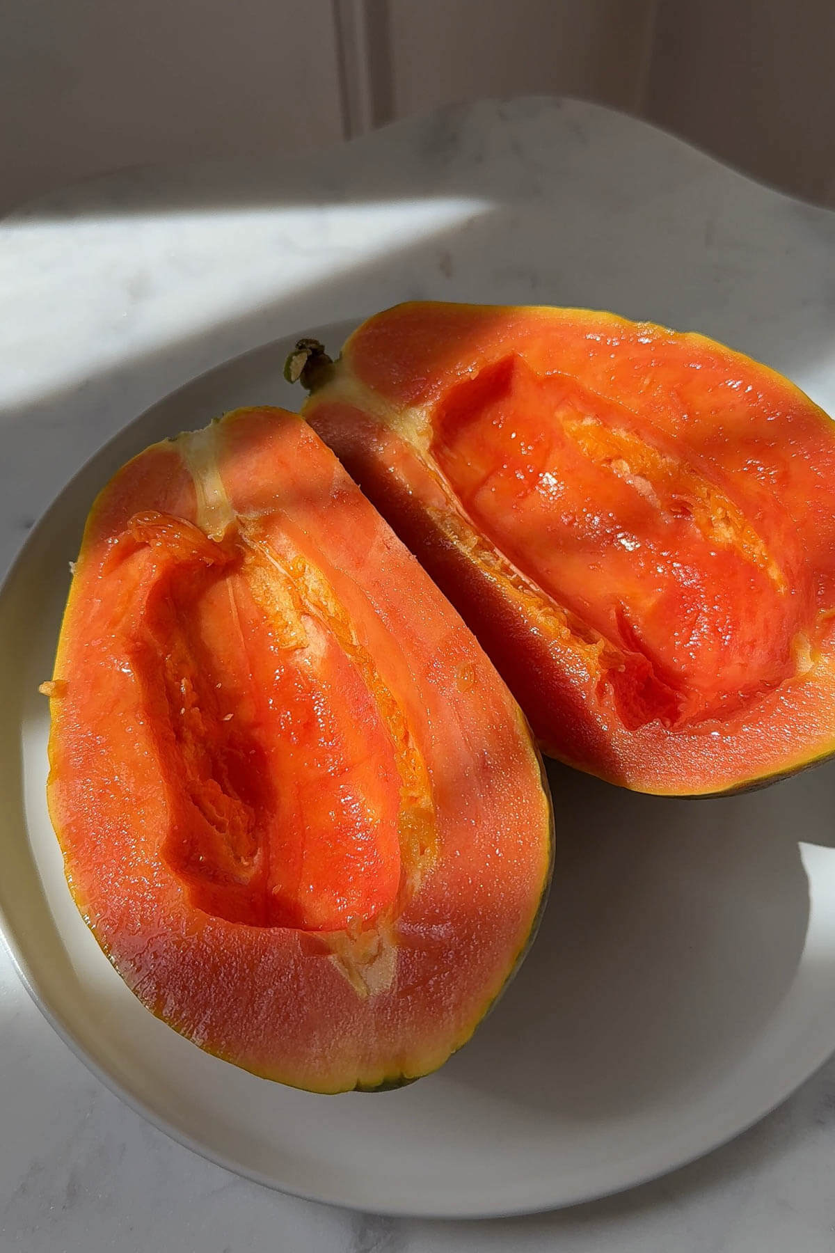Ripe papaya cut in half.