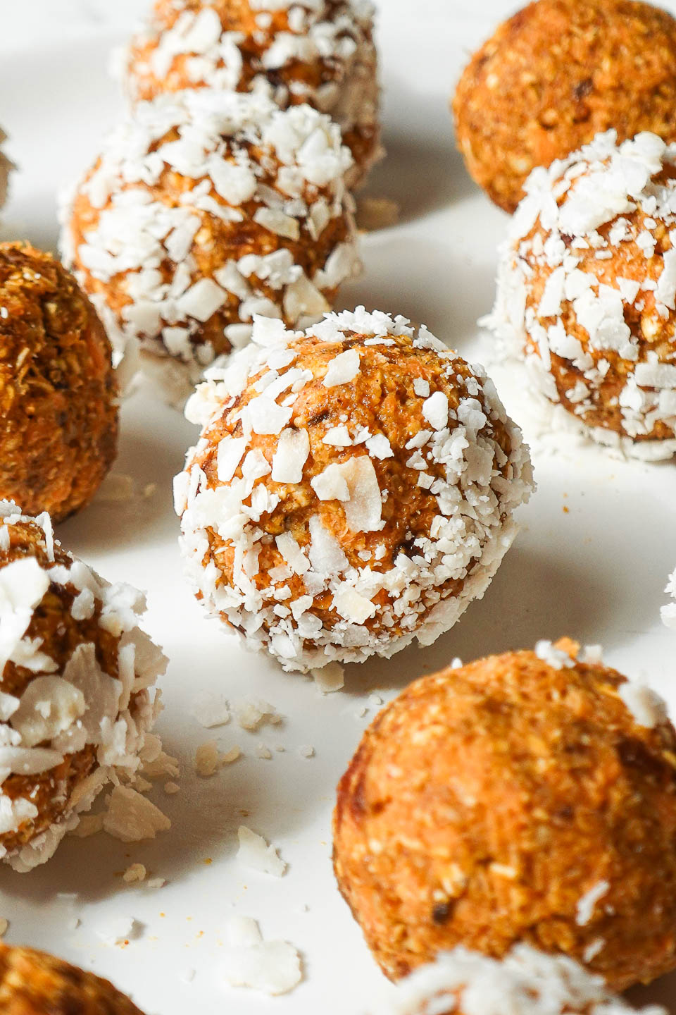 No bake carrot cake energy balls rolled in shredded coconut