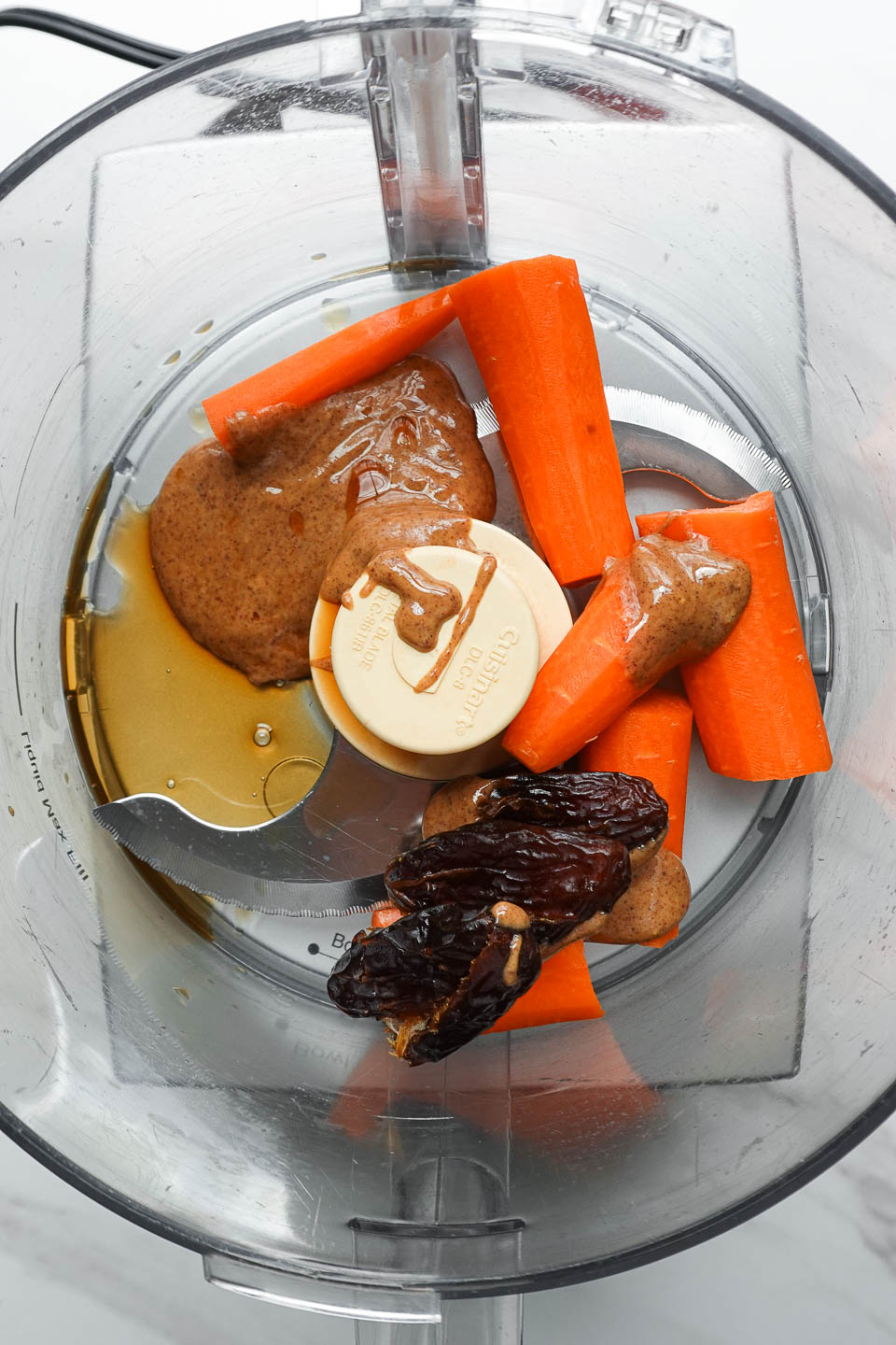 wet ingredients for carrot cake energy balls in food processor