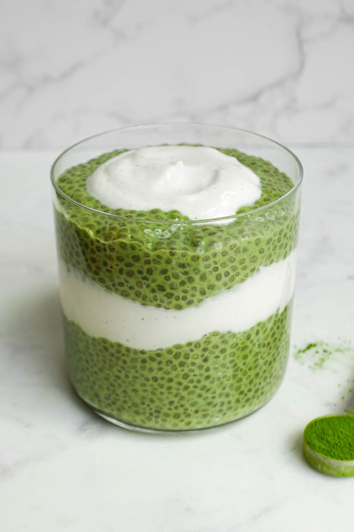 Creamy green matcha chia pudding served in a jar, perfect for a healthy vegan breakfast.