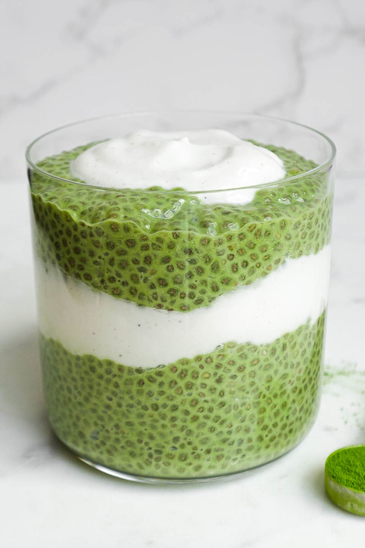 Creamy green matcha chia pudding served in a jar, perfect for a healthy vegan breakfast.
