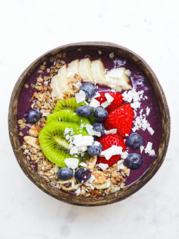 The best vegan acai bowl topped with berries and granola