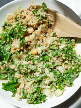 Chickpea quinoa salad with lemon tahini dressing in a white bowl