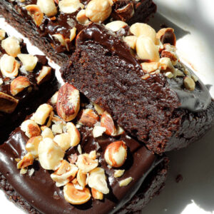 Close-up of rich and fudgy no bake brownies stacked to show ultra fudgy texture