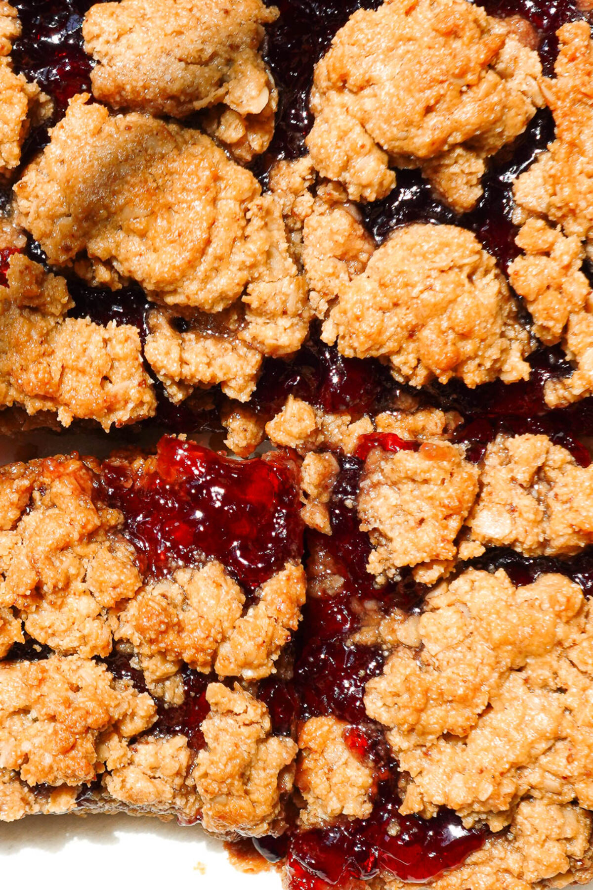 close up of healthy peanut butter and jelly bars, vegan, gluten-free, naturally sweetened