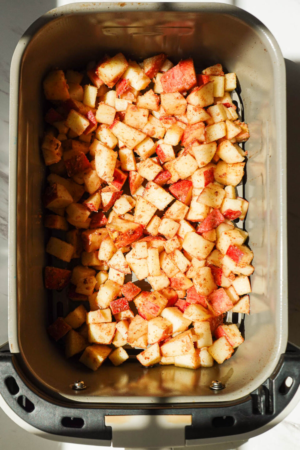 Close-up of diced apples in the air fryer