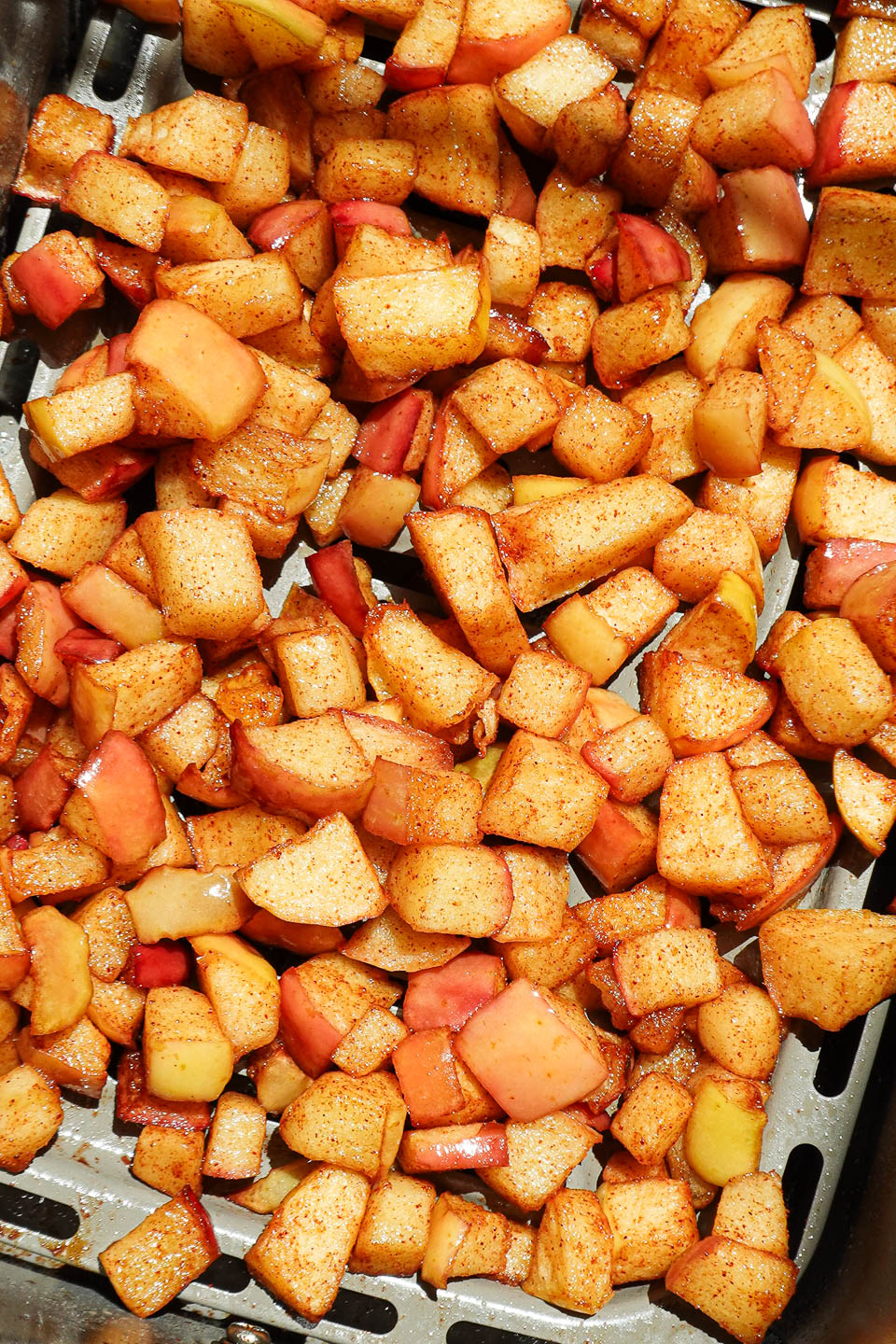 Close-up of diced apples cooked in the air fryer until golden