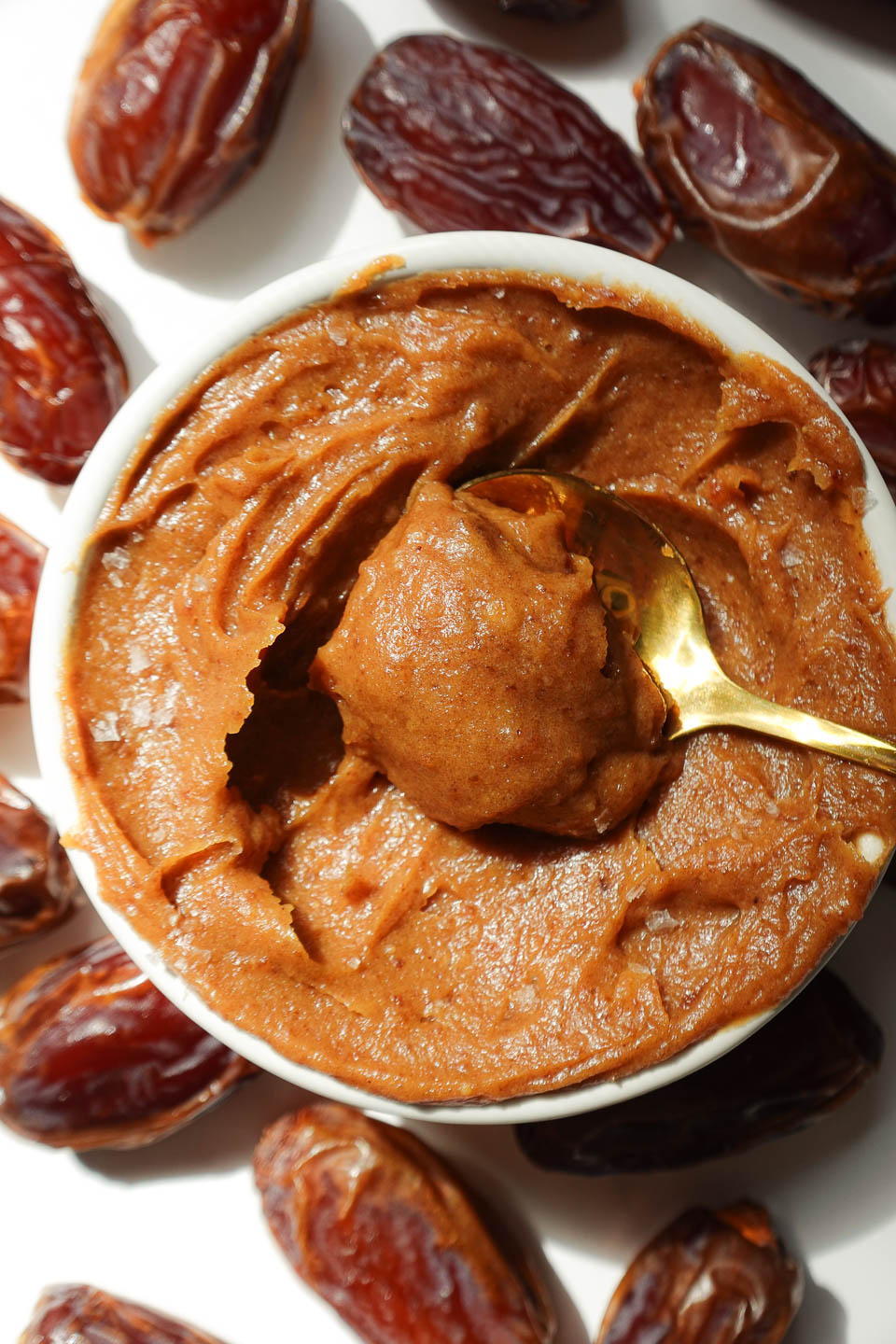 close up of spoon filled with date caramel