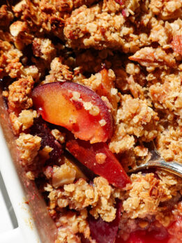 Close-up of juicy baked plums and crunchy crisp topping