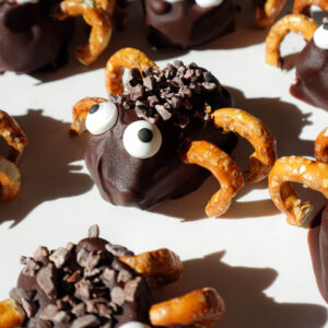 Stuffed date spiders decorated with candy eyes and pretzel legs. A healthy halloween treat!